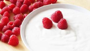 a bowl of yogurt with raspberries
