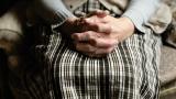 older woman with clasped hands