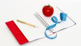 notebook, tape measure and food