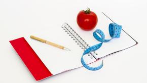 notebook, tape measure and food