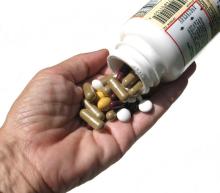 pills.bottle.hand__0.jpg