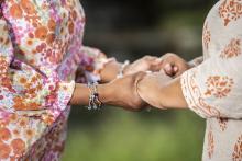 holding hands together support frail